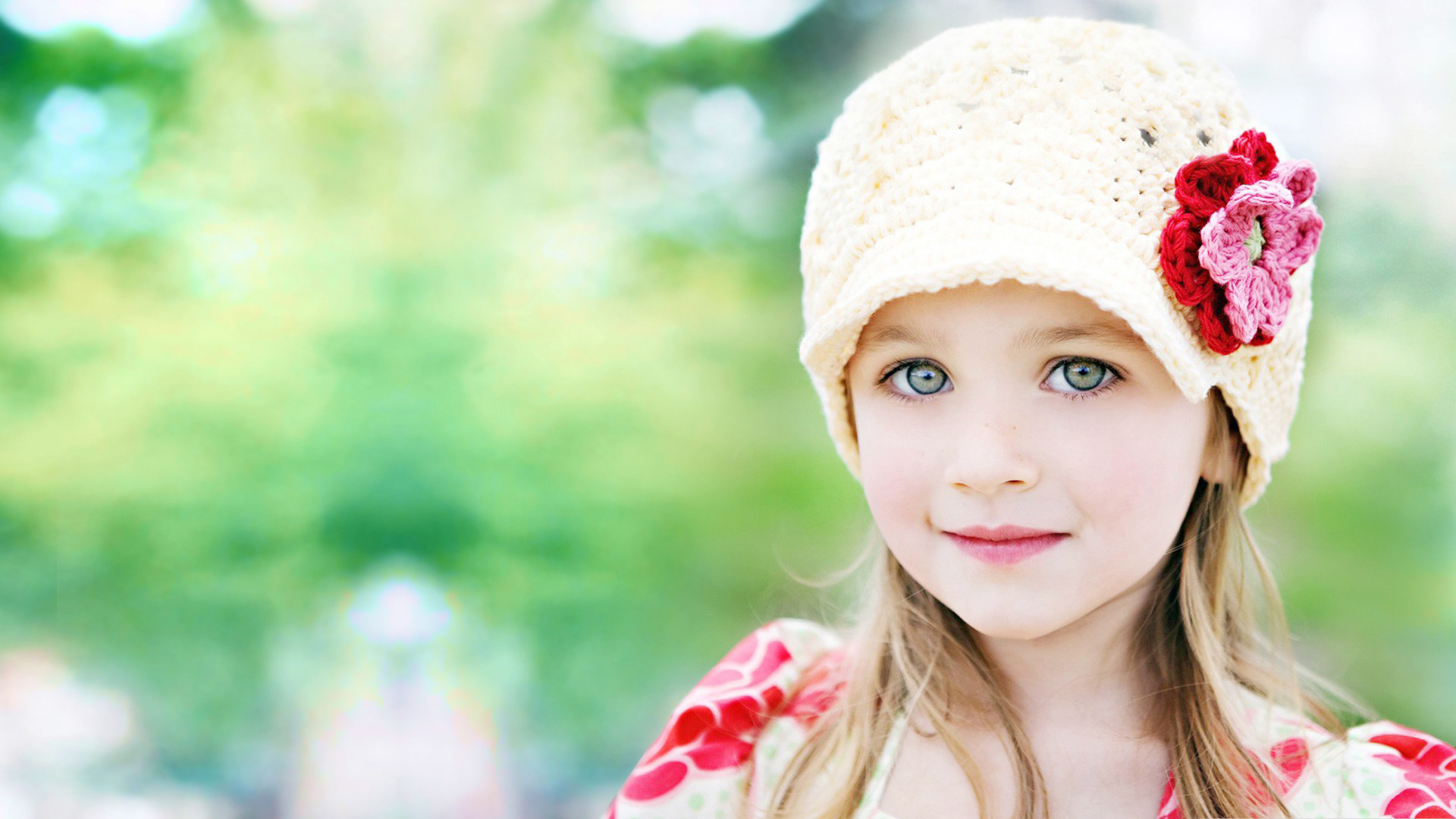 Little Girl Is Wearing Yellow And Red Dress And Wool Knitted Cap On Head Standing In Blur Wallpaper HD