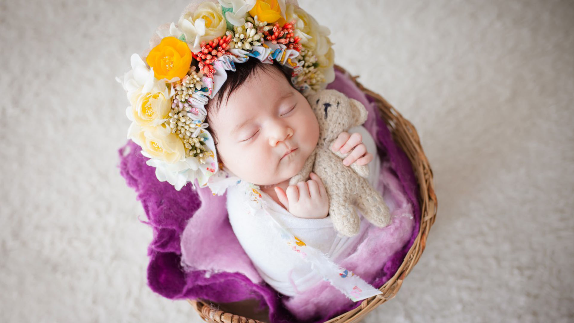 Newborn With Flower Wreath Is Sleeping On Fur Basket Teddy HD