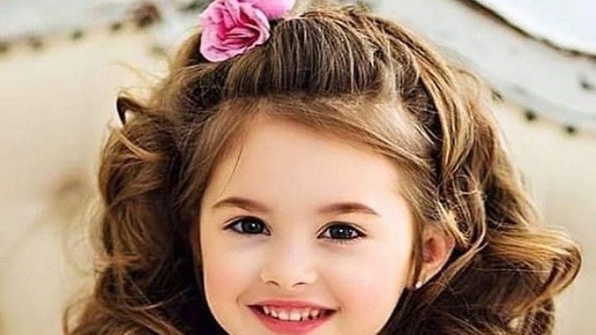Smiley Little Girl Face In Blur Wallpaper HD