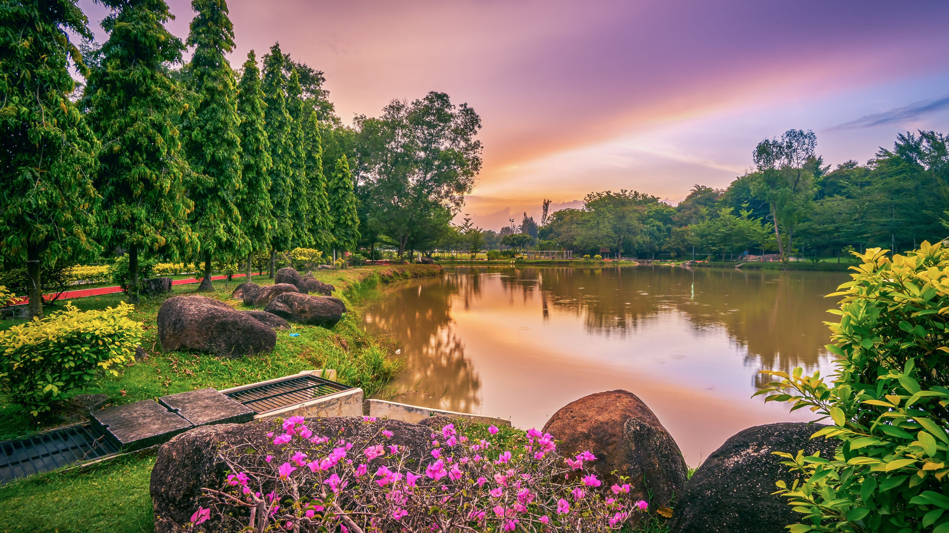 Lake Surrounded By Green Trees And Flowers Under Light Purple Sky K HD Nature