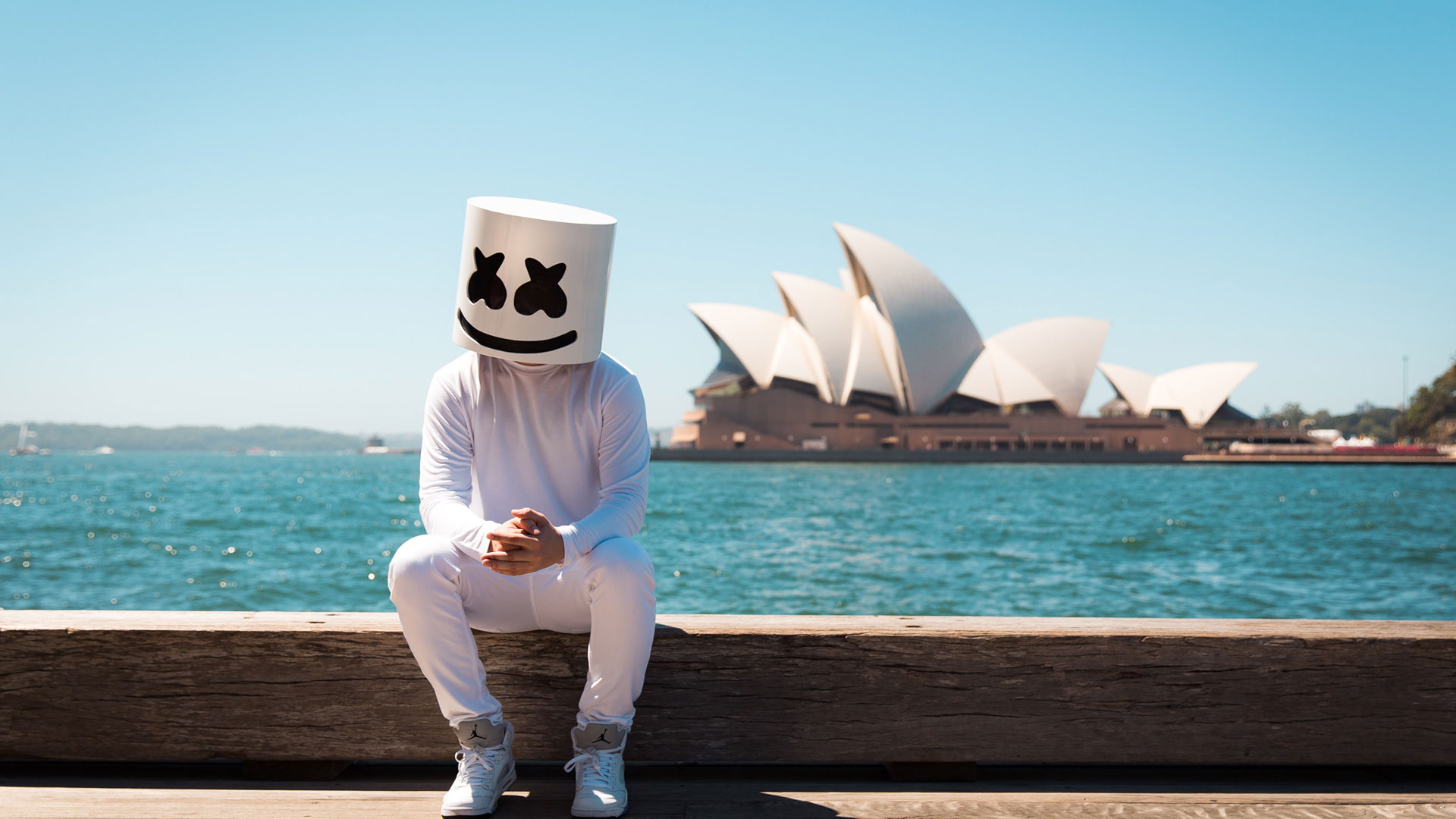 DJ Marshmello Is Sitting On Wood In Ocean Wallpaper Wearing White Dress HD Marshmello