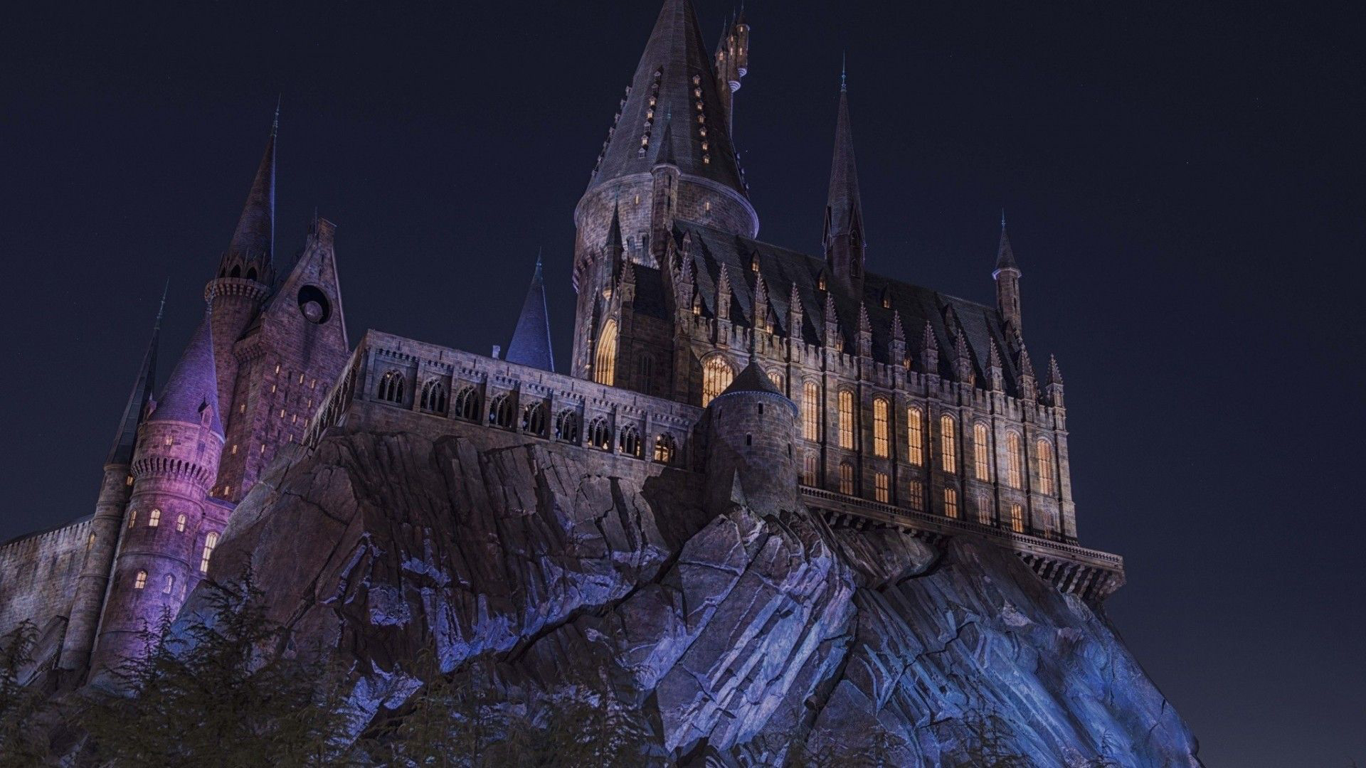 Hogwarts on K of mountain during nighttime hd