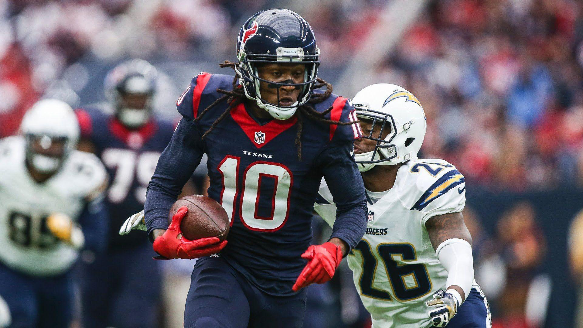 Deandre Hopkins Is Wearing Blue Dress And Helmet And Red Gloves On Hands With Baseball HD Deandre Hopkins