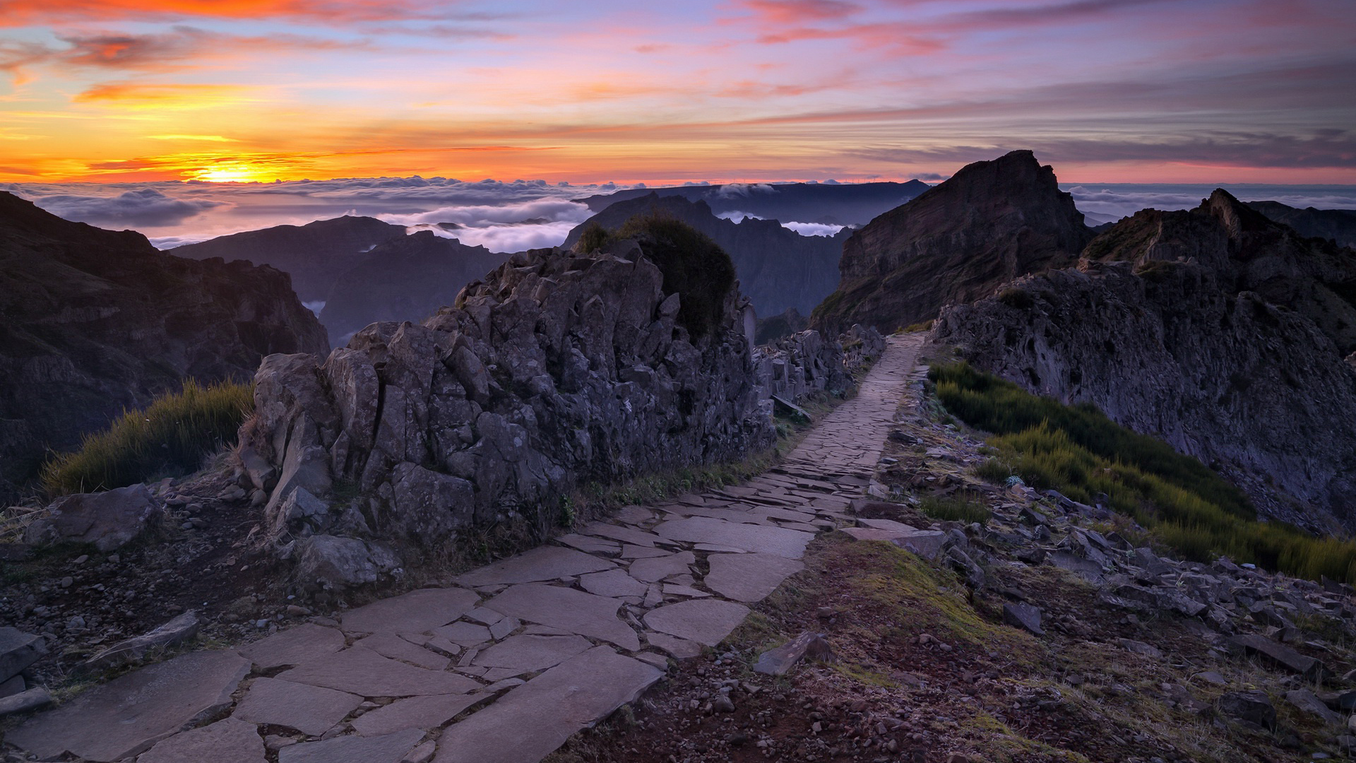 Stone Path Between Green Grass Field And Rock Mountains During Sunset HD Nature