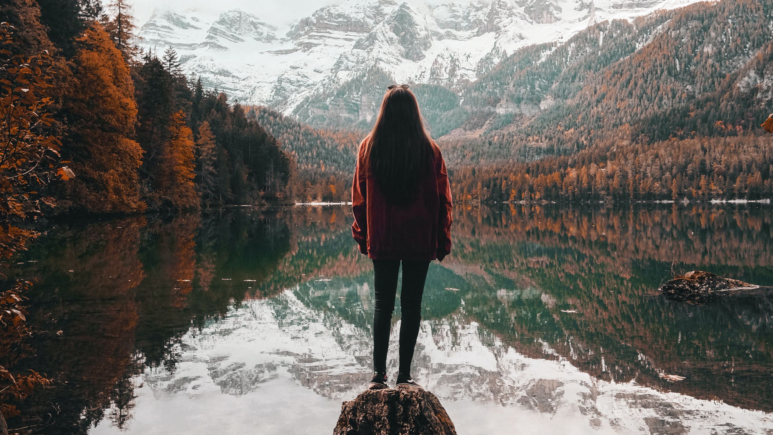 Girl Is Standing Alone On Rock Stone Near Lake With Reflection Of Mountains And Trees HD Alone
