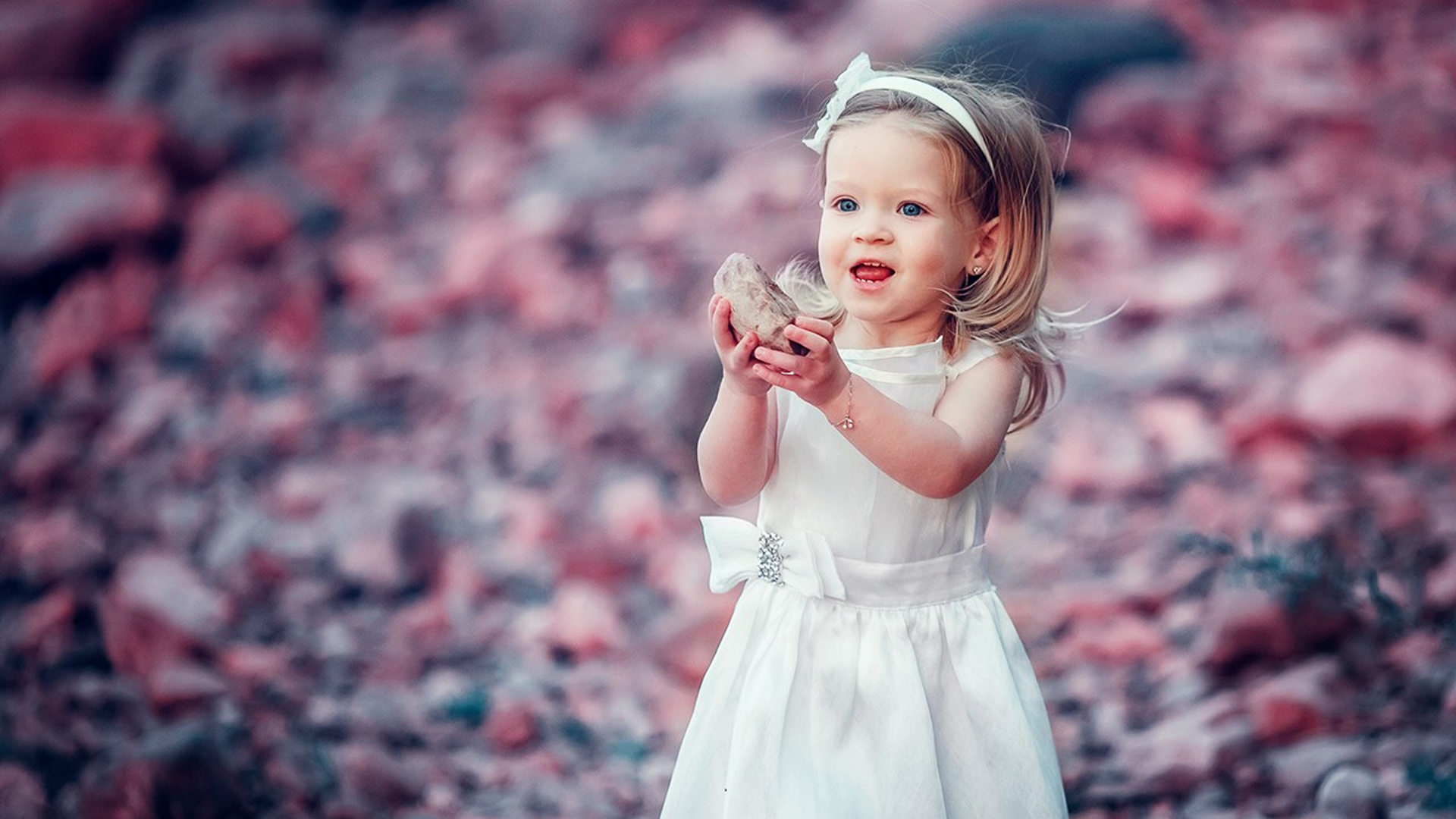 Beautiful Little Girl Is Standing In Blur Colorful Wallpaper Wearing White Dress HD