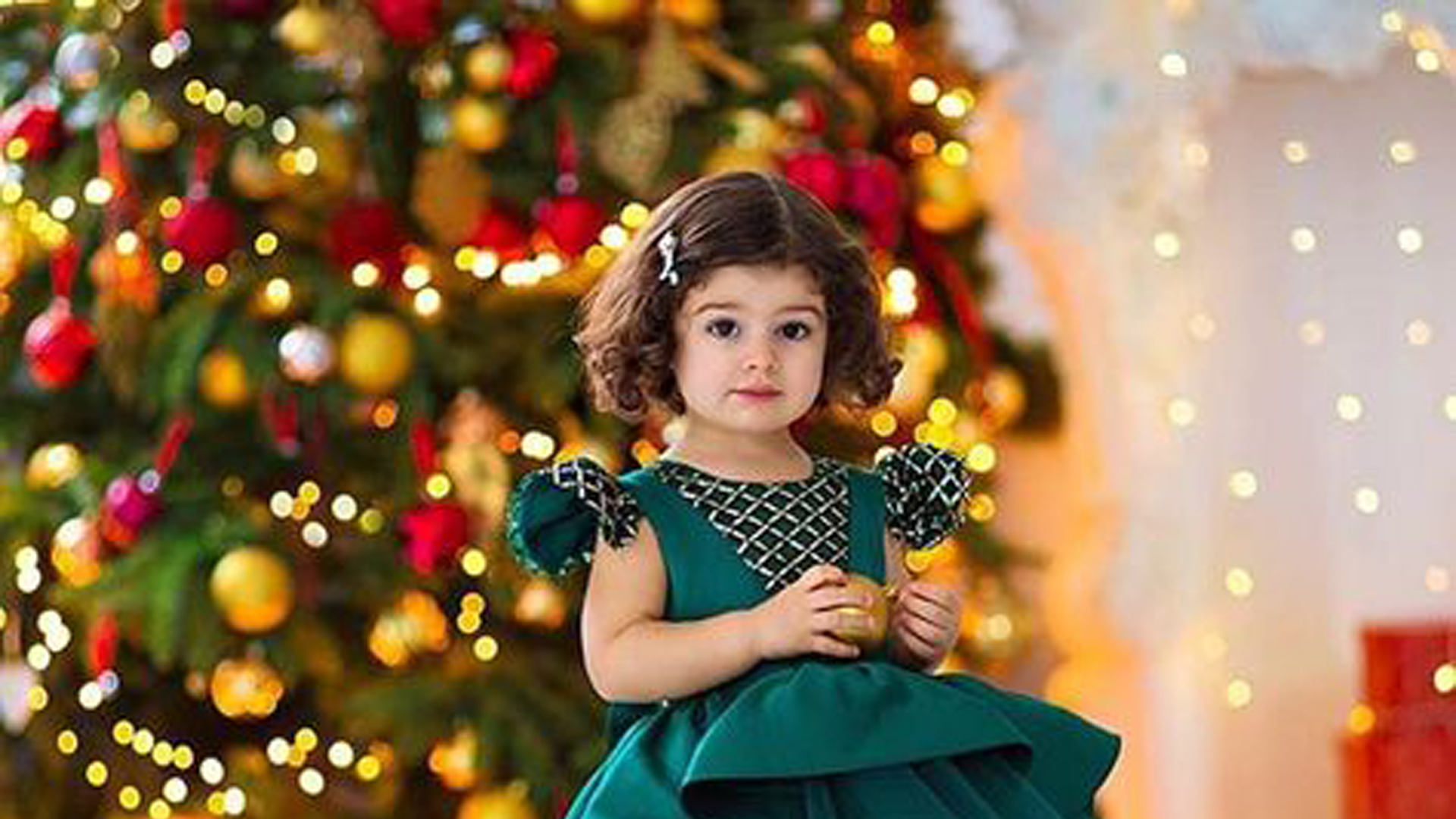 Beautiful Little Girl Is Standing In Decorated Christmas Tree Wallpaper Wearing Green Dress HD