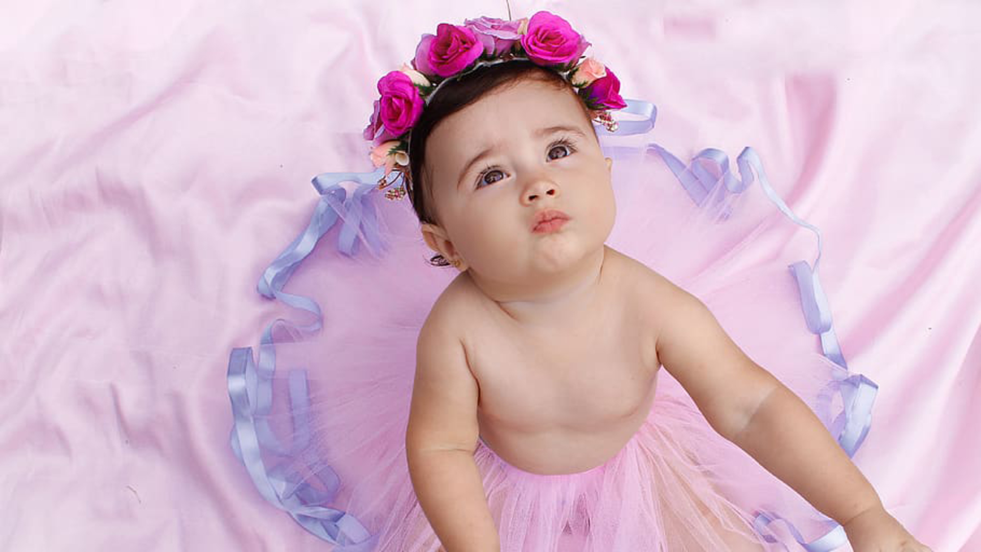 Girl Baby Child Is Looking Up Wearing Pink Satin Dress And Wreath HD