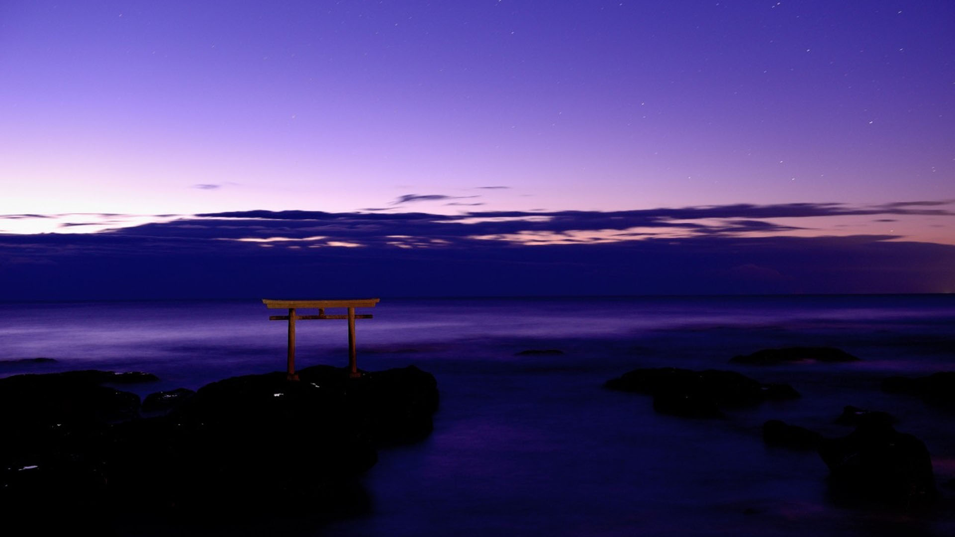 Purple Cloudy Sky Above Body Of Water And Wooden Bench On Rock HD Nature